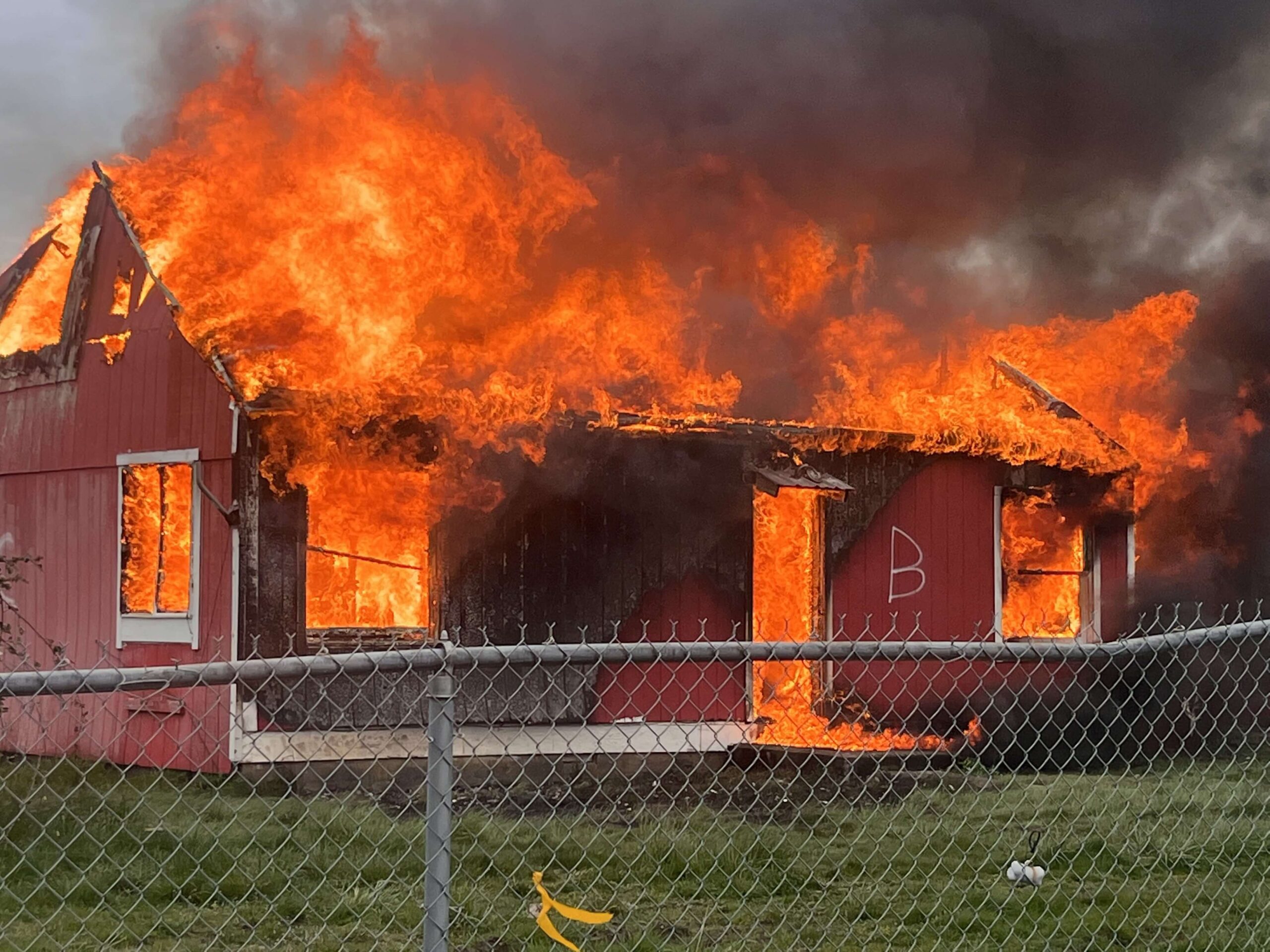 Old building being burned by learning fire fighters